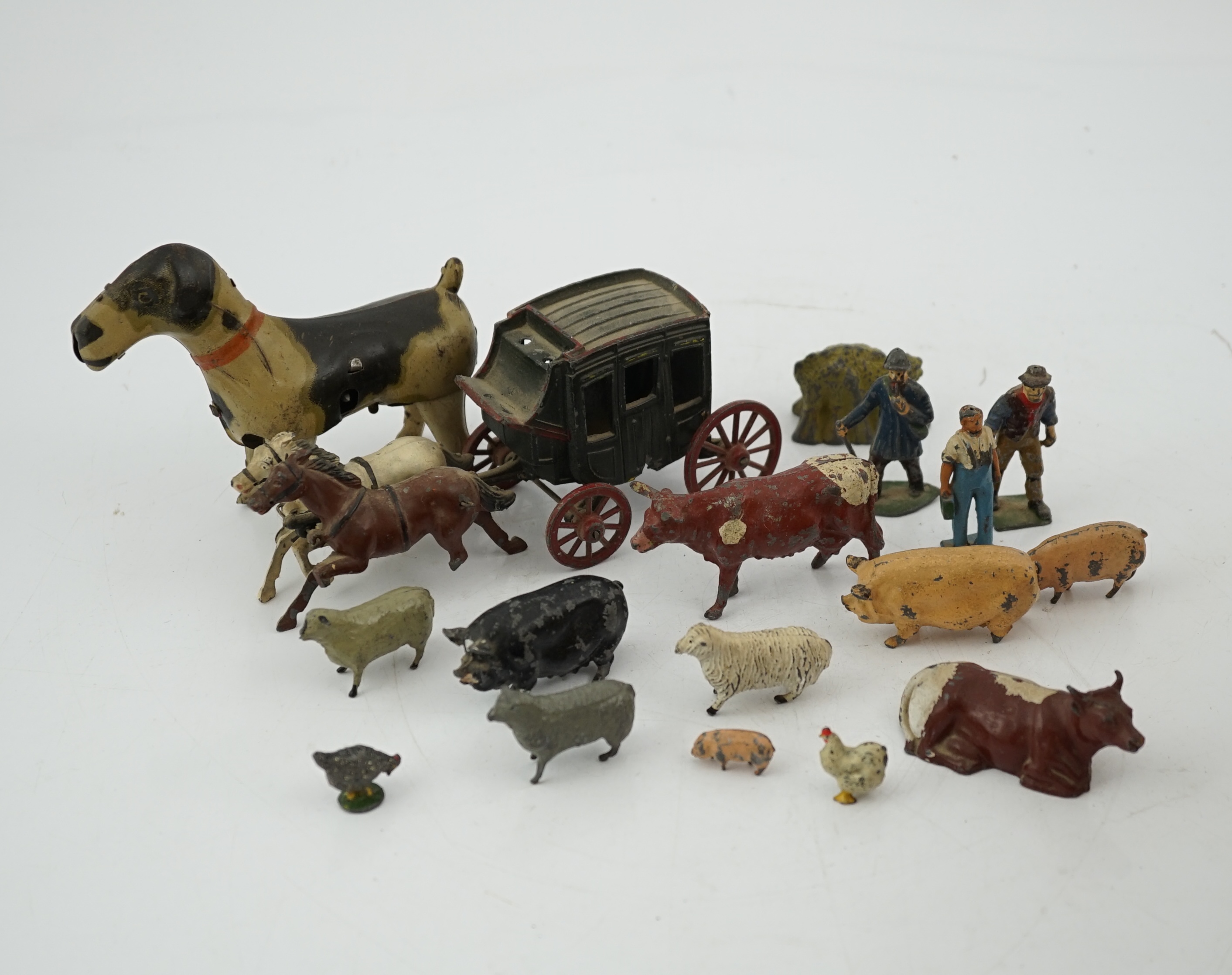 A collection of Britains, etc. lead farm animals and accessories, including the farmer, farmer’s wife, a coach and horses and other figures